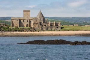 a large body of water with a mountain in the background