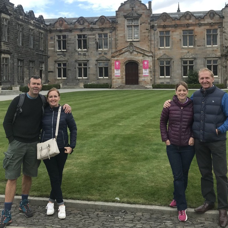 a group of people standing in front of a building