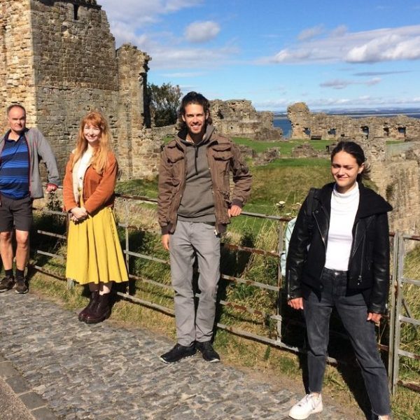 a group of people standing in front of a building