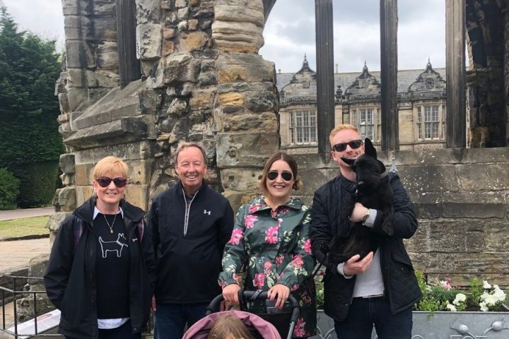 a group of people standing in front of a building