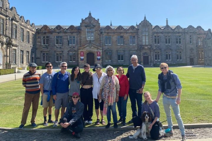 a group of people standing in front of a building
