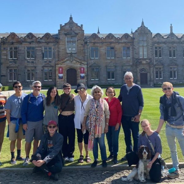 a group of people standing in front of a building