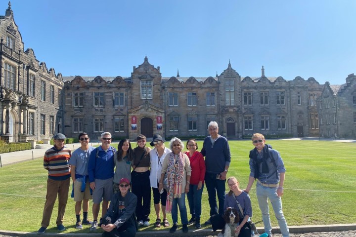 a group of people standing in front of a building