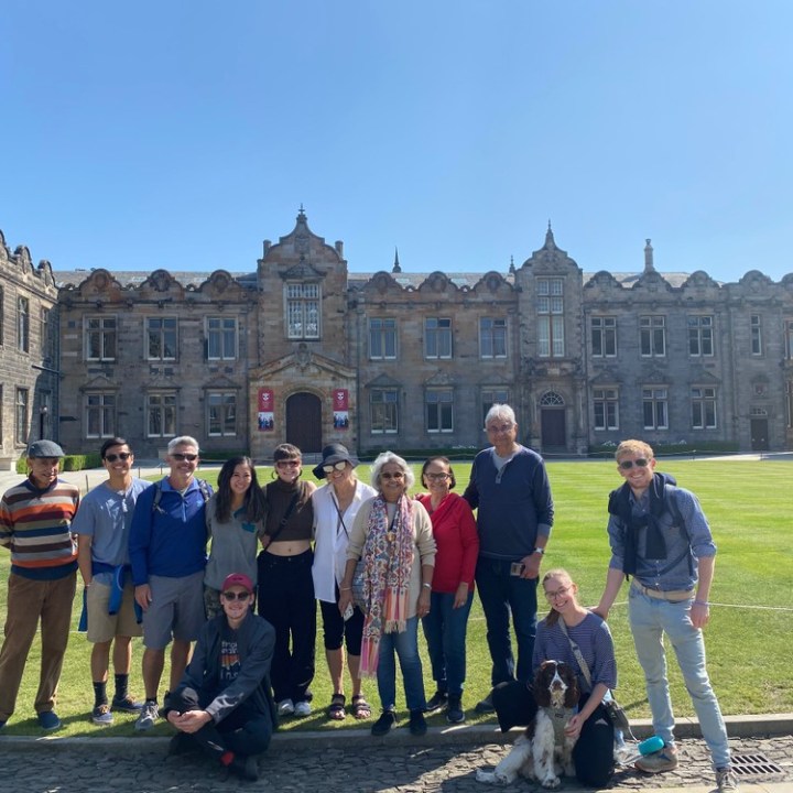 a group of people standing in front of a building