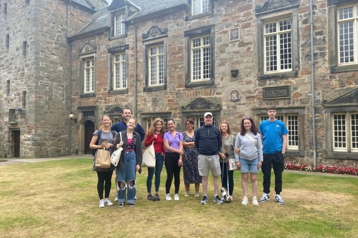 a group of people standing in front of a building