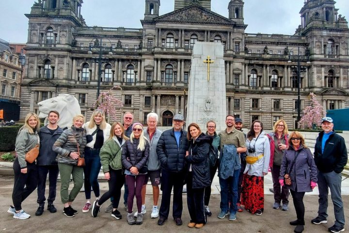 a group of people standing in front of a building