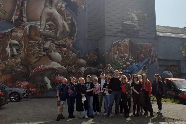 a group of people standing in front of a building