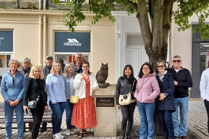 a group of people standing in front of a building