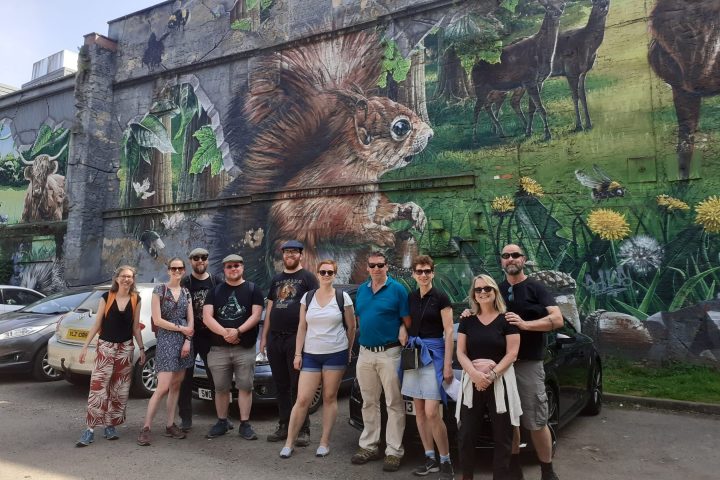 a group of people standing in front of a building