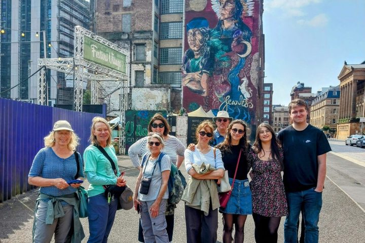 a group of people standing in front of a building