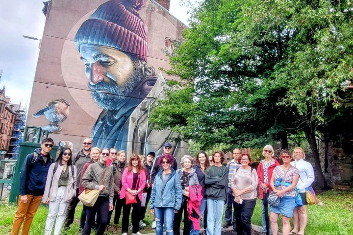 a group of people standing in front of a crowd