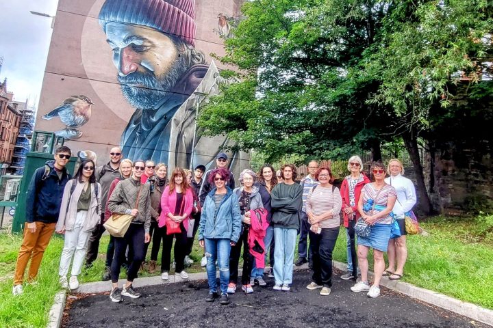 a group of people standing in front of a crowd