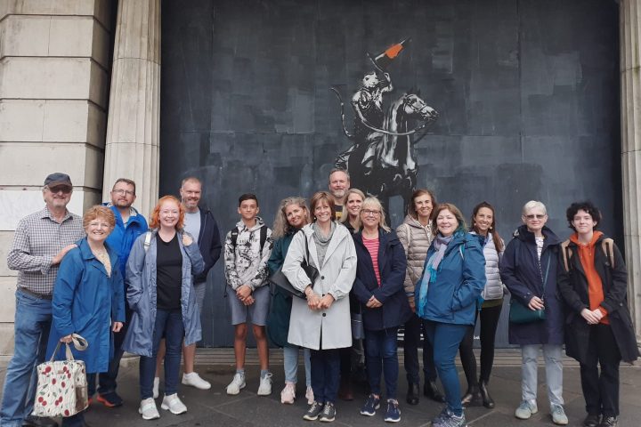 a group of people standing in front of a building