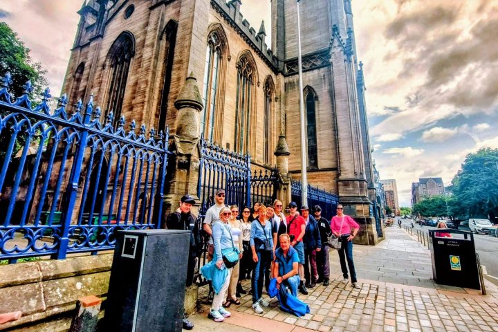 a group of people standing in front of a building