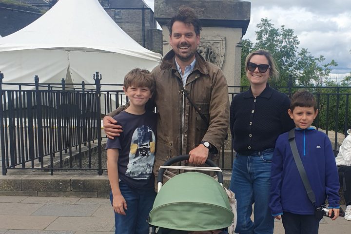 a group of people walking down a street