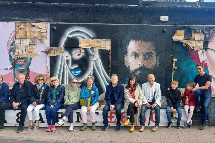 a group of people standing in front of a building