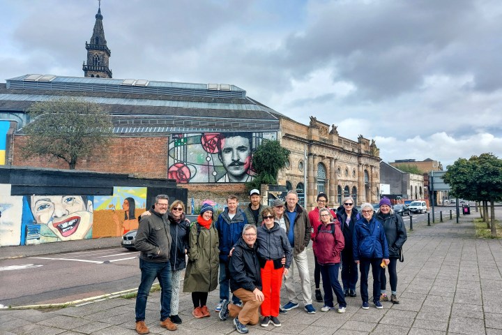 a group of people standing in front of a building