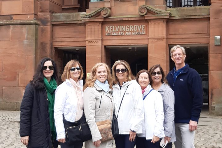 a group of people standing in front of a building