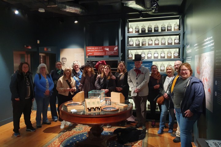 Zita Pleštinská et al. standing around a table