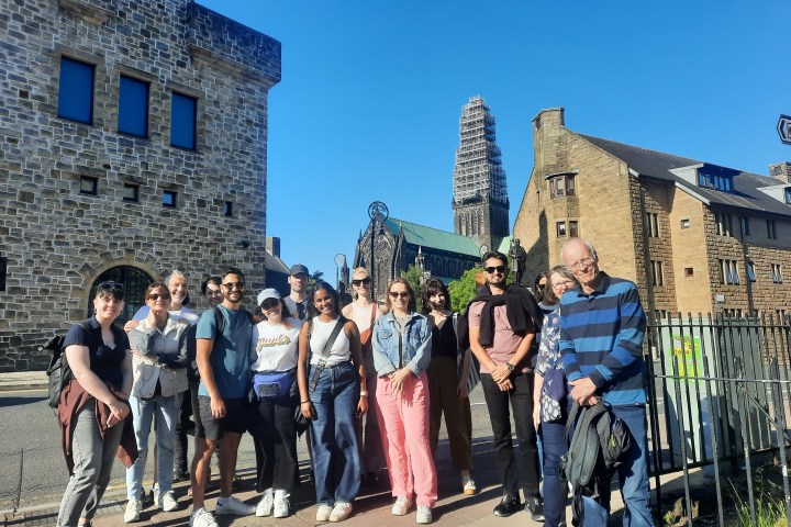 a group of people standing in front of a building