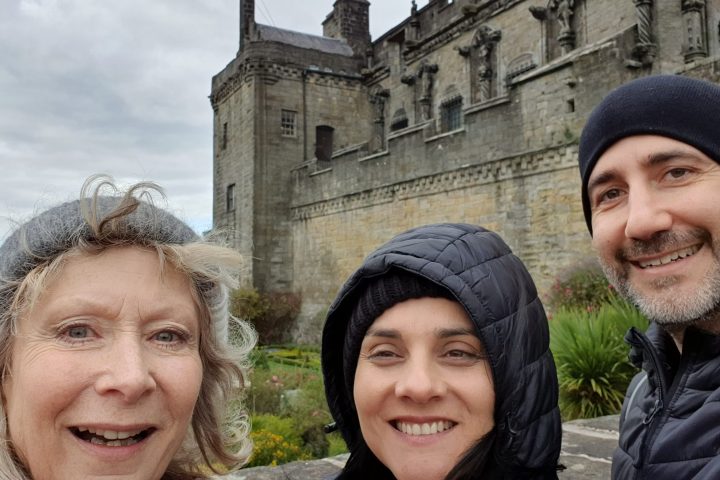 a smiling man and woman posing for the camera