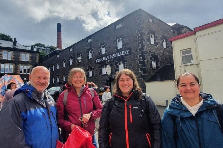 a group of people standing in front of a building