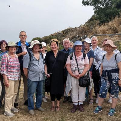 a group of people standing in front of a crowd posing for the camera
