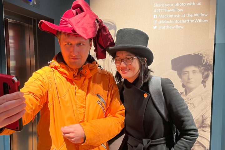 a man and a woman wearing a hat