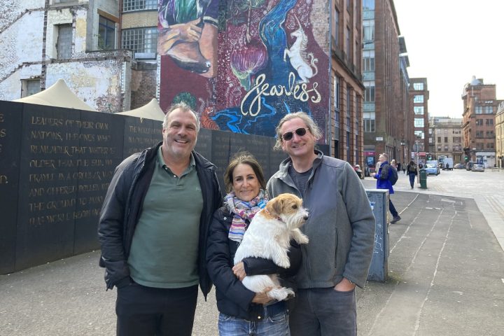 a group of people standing in front of a building