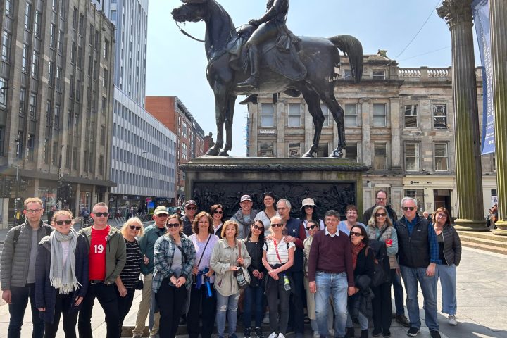 a group of people standing in front of a building