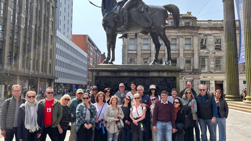 a group of people standing in front of a building