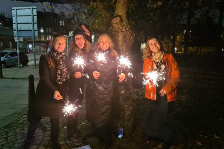 a group of people at night