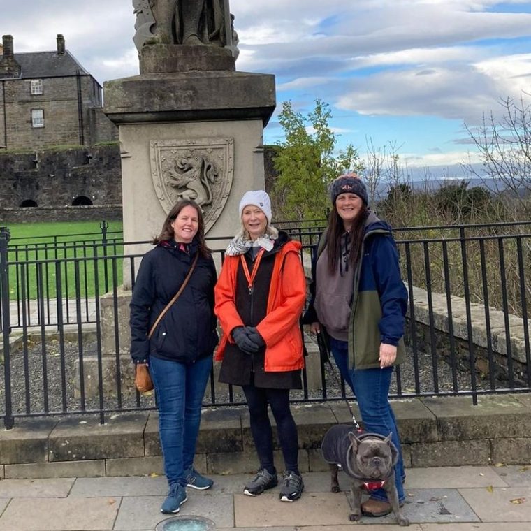 a group of people standing in front of a building