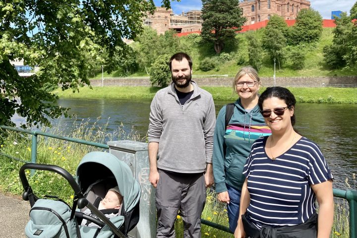 a person standing next to a body of water