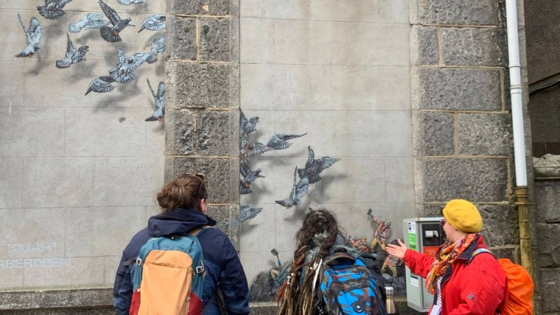 a group of people standing in front of a building