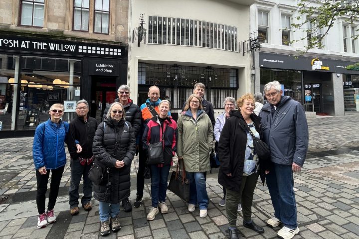 a group of people standing in front of a building