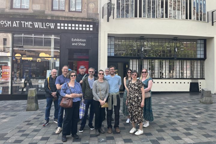 a group of people standing in front of a building