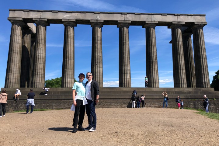 a group of people standing in front of a building