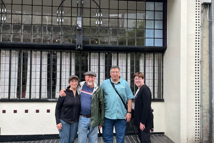 a group of people standing in front of a building