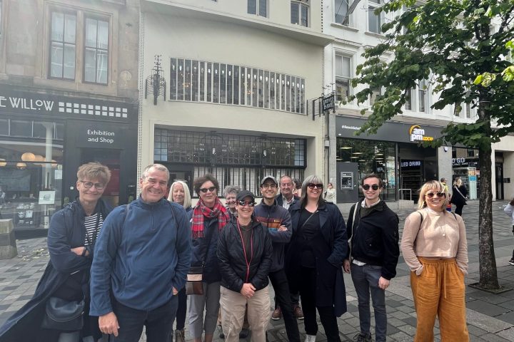 a group of people standing in front of a building