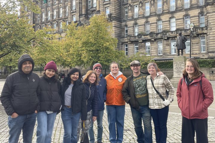 a group of people standing in front of a building