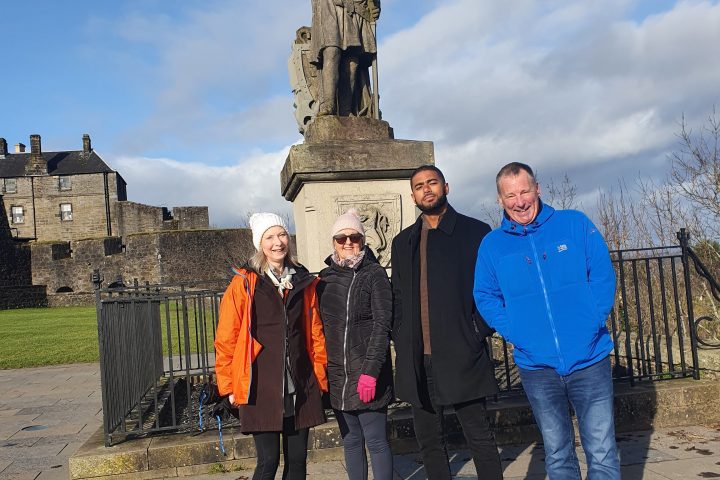 a group of people standing in front of a building