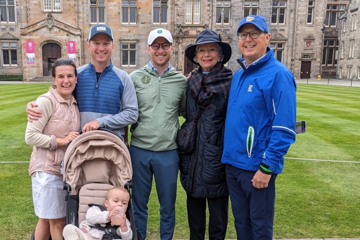 a group of people standing in front of a building
