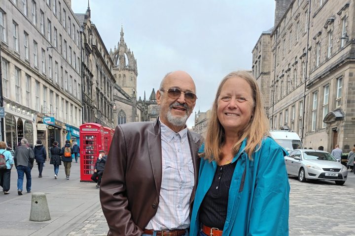 a woman standing in front of a building
