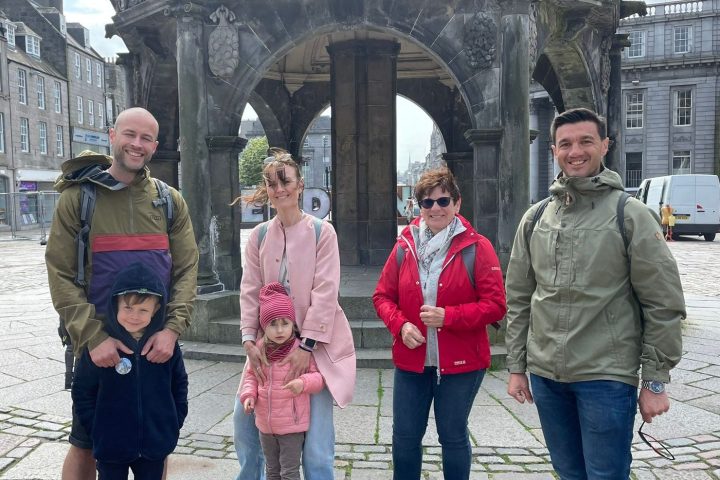 a group of people standing in front of a building