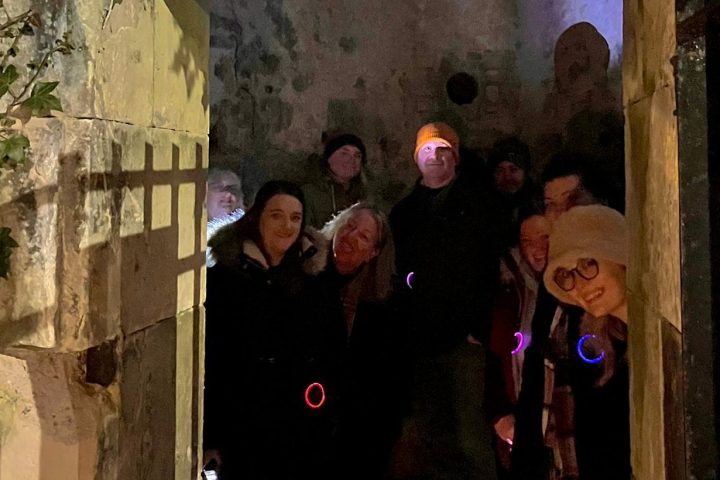 a group of people standing in front of a building