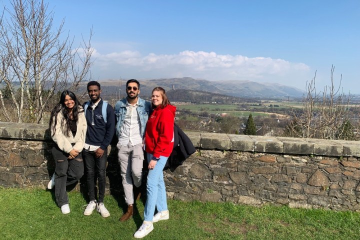a group of people standing in a field