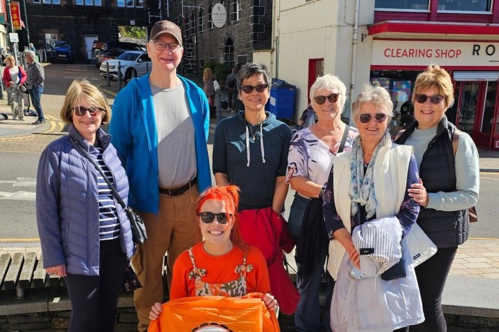 a group of people standing in front of a building