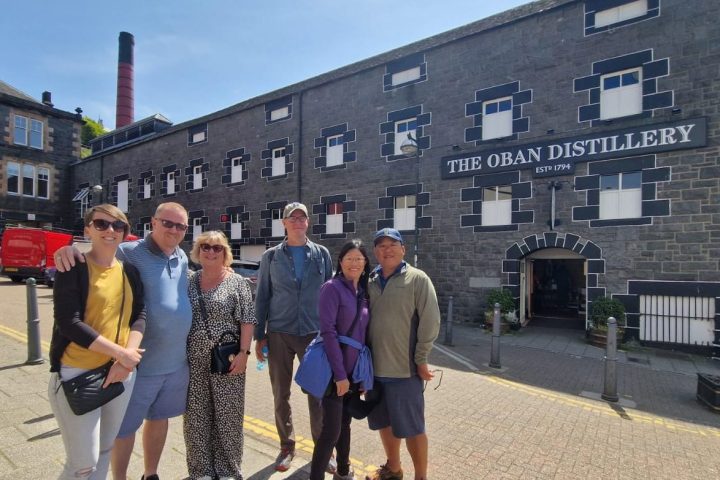 a group of people standing in front of a building