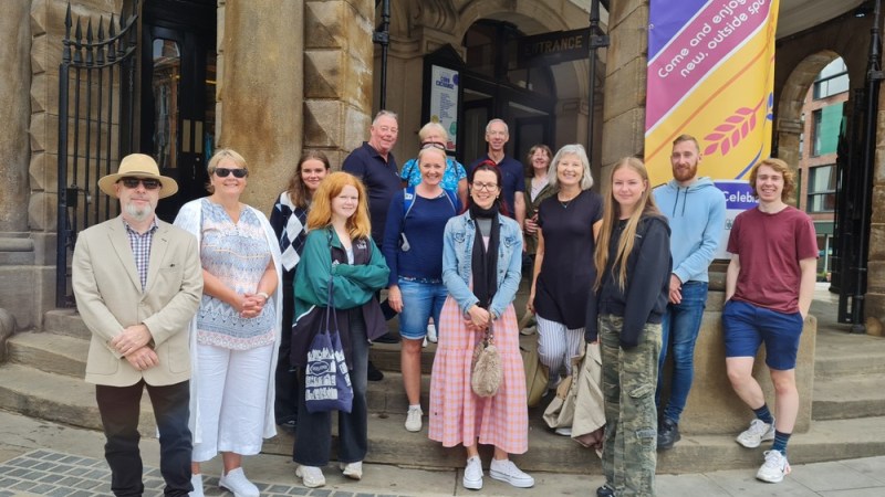 a group of people standing in front of a building